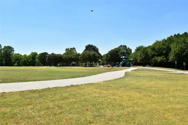 a view of a swimming pool and a yard