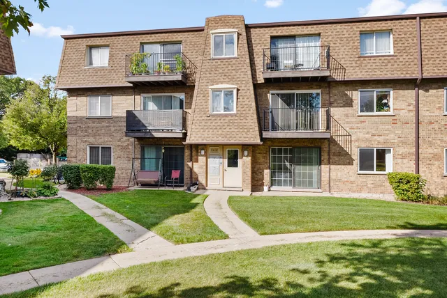 a view of a building with a yard