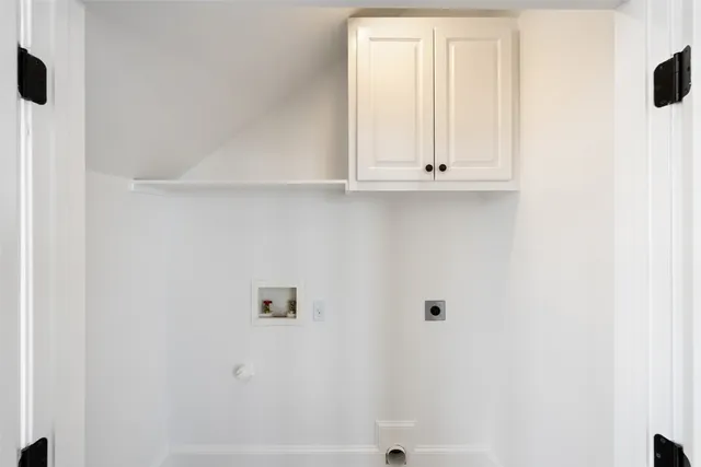 a view of a white house with a big yard