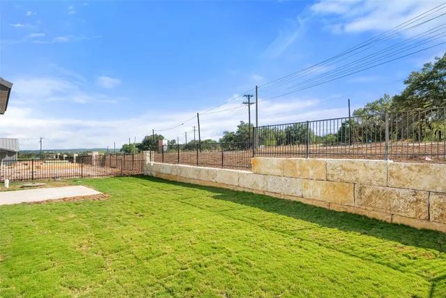 a view of a city with lush green forest