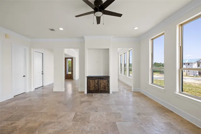 a view of an empty room with a window