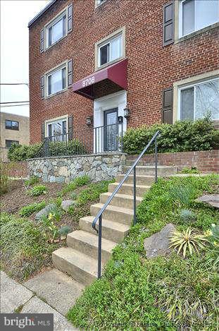 8708 Bradford Road, Unit 301 Silver Spring, MD 20901 - Photo 11 of 13 a house view with a garden space