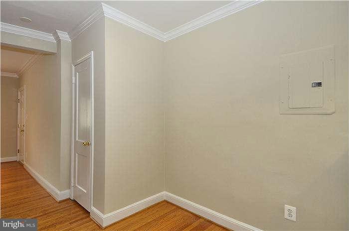8708 Bradford Road, Unit 301 Silver Spring, MD 20901 - Photo 5 of 13 a view of a hallway with wooden floor