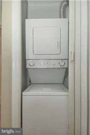 8708 Bradford Road, Unit 301 Silver Spring, MD 20901 - Photo 10 of 13 a utility room with dryer and washer
