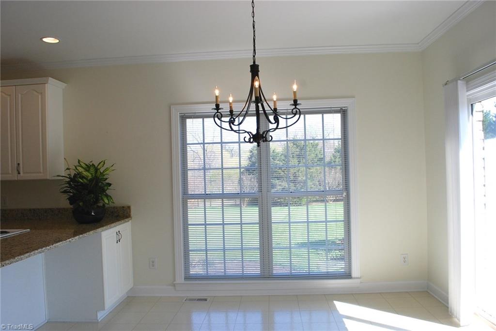 5301 Ridge Trail Road Summerfield, NC 27358 - Photo 11 of 30 Breakfast room has plenty of room for a dinette set plus bar stools.