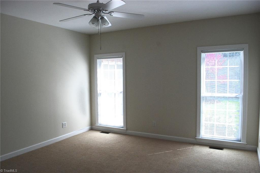 5301 Ridge Trail Road Summerfield, NC 27358 - Photo 14 of 30 Master bedroom has been freshly painted & features a ceiling fan, sitting room & a large walk-in closet.