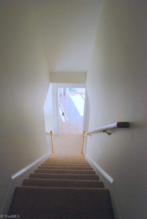 5301 Ridge Trail Road Summerfield, NC 27358 - Photo 21 of 30 Permanent stairs from great room lead to an expandable attic.