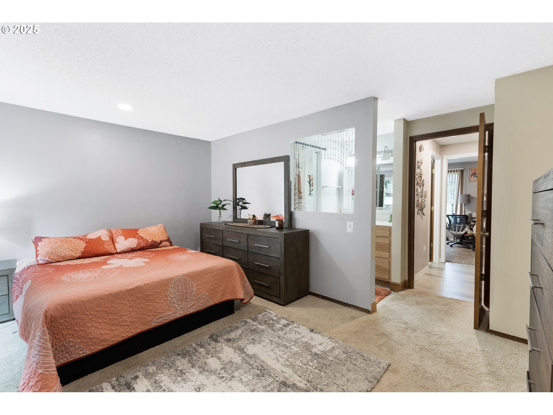 11398 Southwest Ironwood Loop Portland, OR 97223 - Photo 20 of 44 a bedroom with a bed and walk in closet