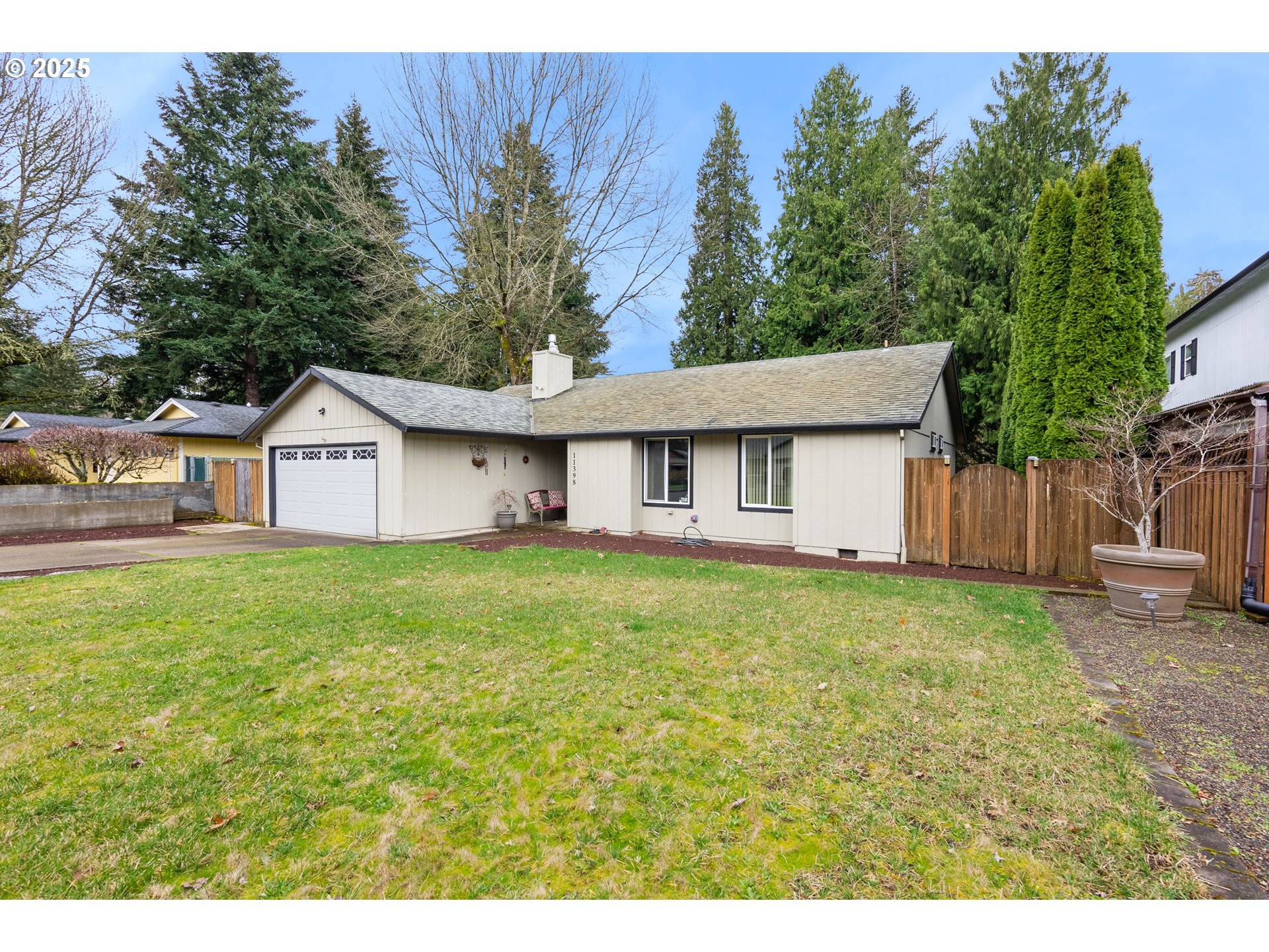 11398 Southwest Ironwood Loop Portland, OR 97223 - Photo 2 of 44 a view of a house with backyard and garden