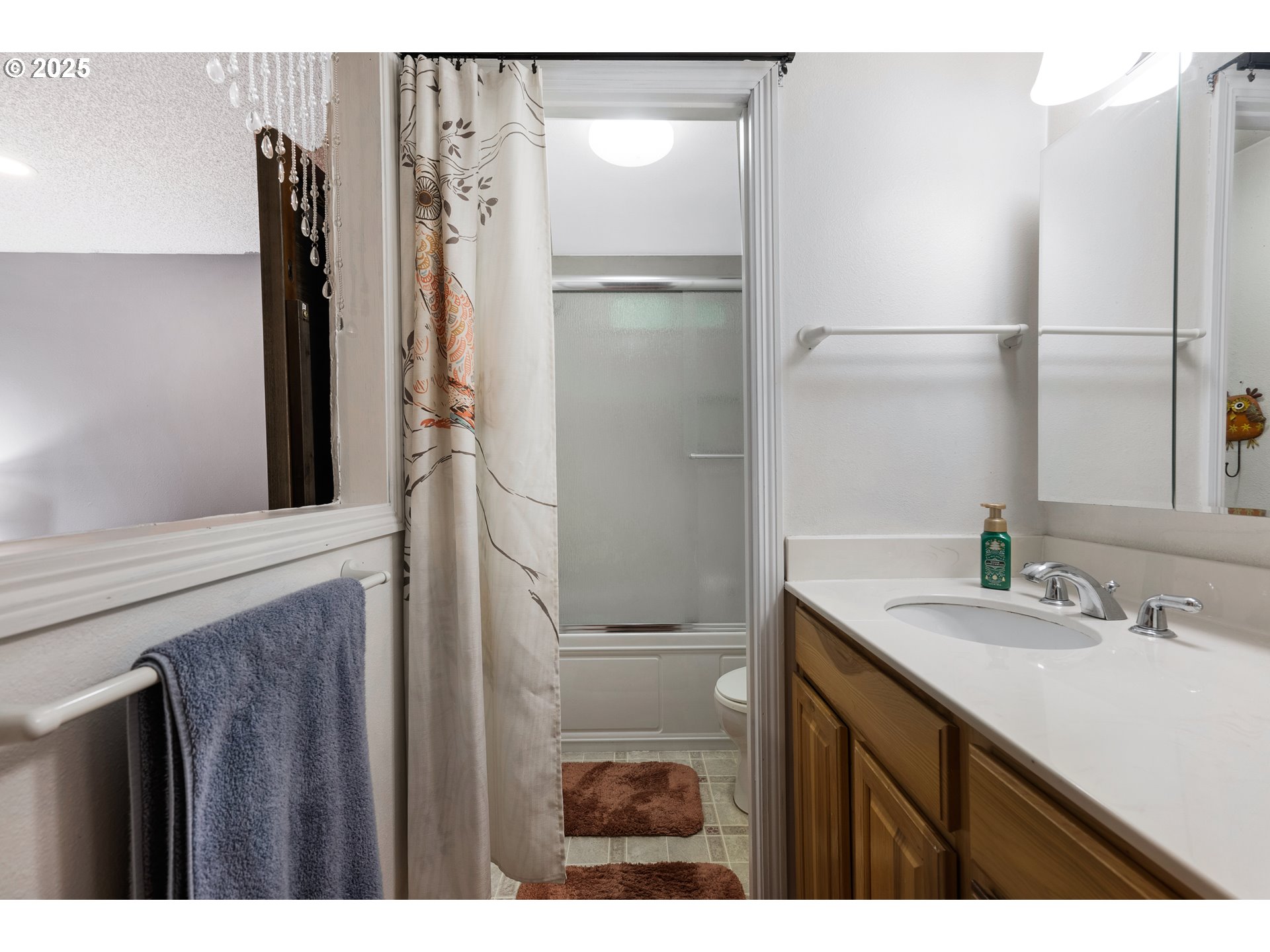 11398 Southwest Ironwood Loop Portland, OR 97223 - Photo 21 of 44 a bathroom with a sink and a mirror