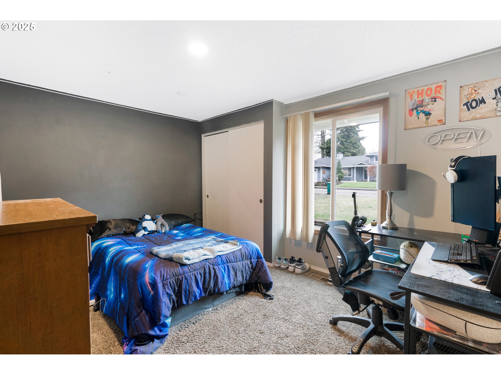 11398 Southwest Ironwood Loop Portland, OR 97223 - Photo 23 of 44 a bedroom with a bed and a computer on the desk