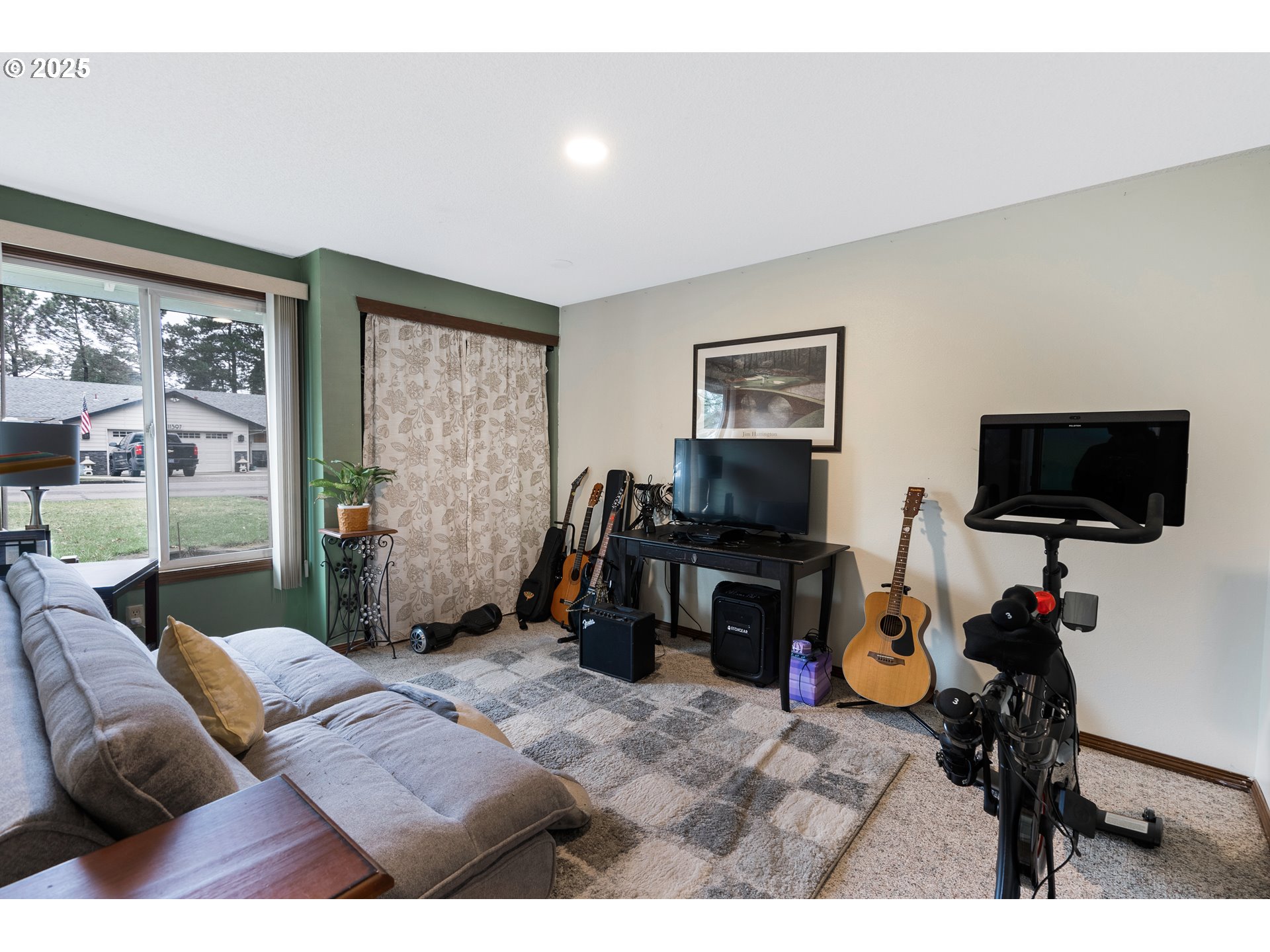 11398 Southwest Ironwood Loop Portland, OR 97223 - Photo 24 of 44 a bedroom with furniture and a flat screen tv