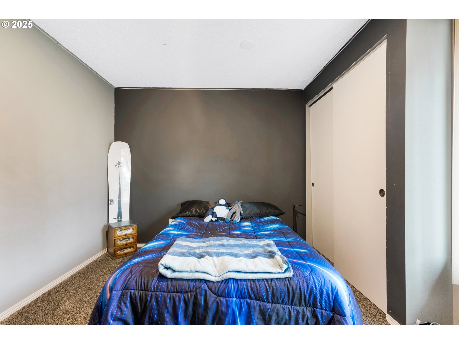 11398 Southwest Ironwood Loop Portland, OR 97223 - Photo 27 of 44 a bedroom with a bed and a table