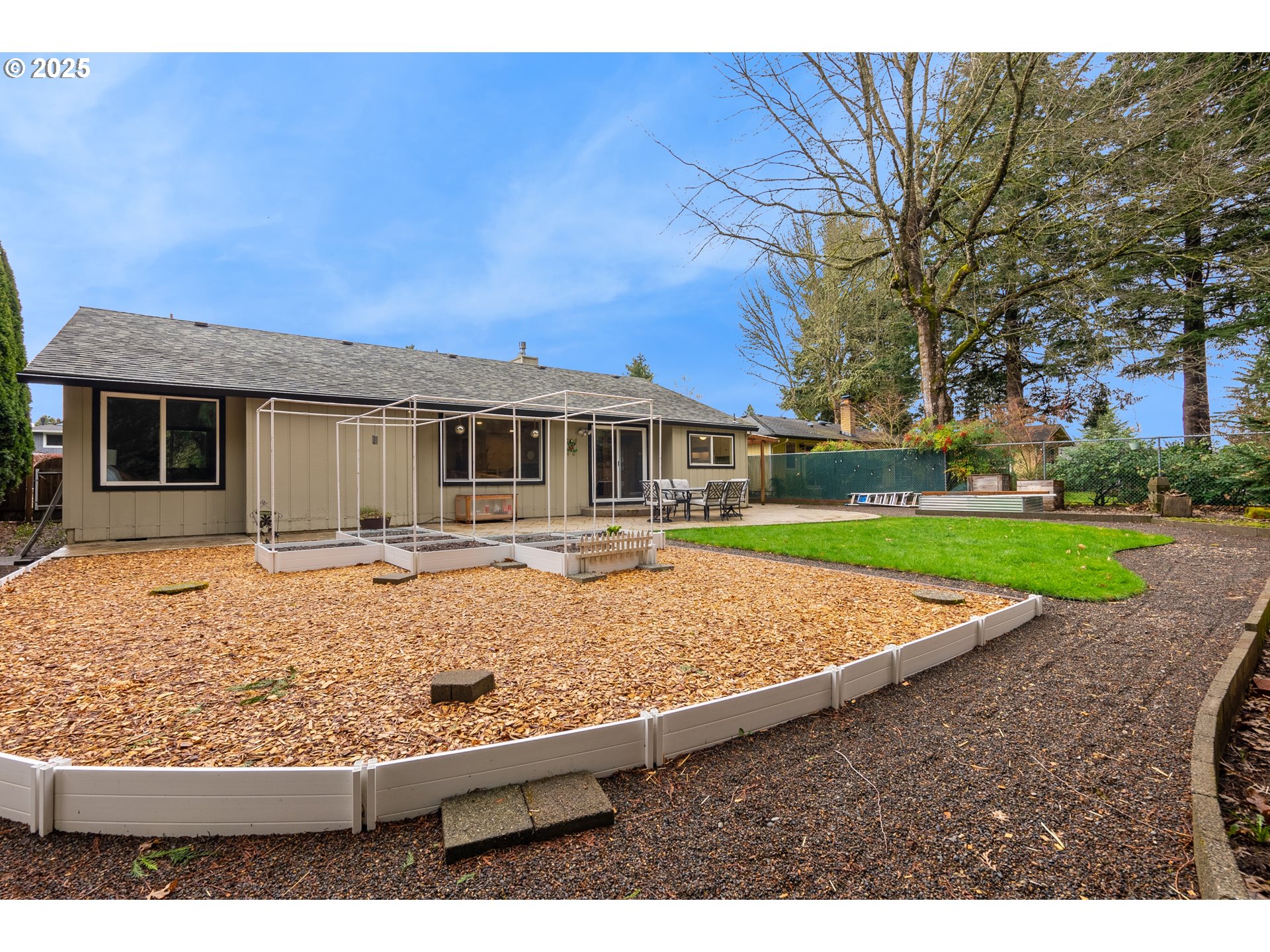 11398 Southwest Ironwood Loop Portland, OR 97223 - Photo 35 of 44 a view of house with yard outdoor seating and covered with trees