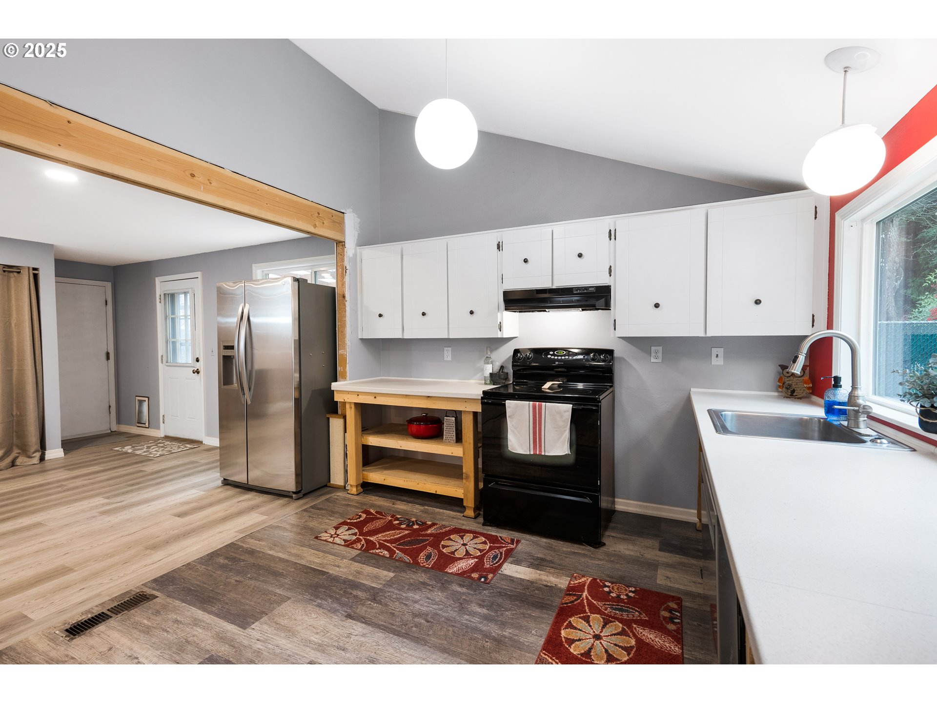 11398 Southwest Ironwood Loop Portland, OR 97223 - Photo 10 of 44 a kitchen with a refrigerator and a stove top oven