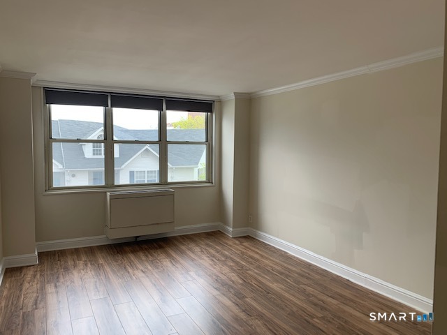 50 Glenbrook Road, Unit 5G Stamford, CT 06902 - Photo 34 of 40 an empty room with wooden floor and windows