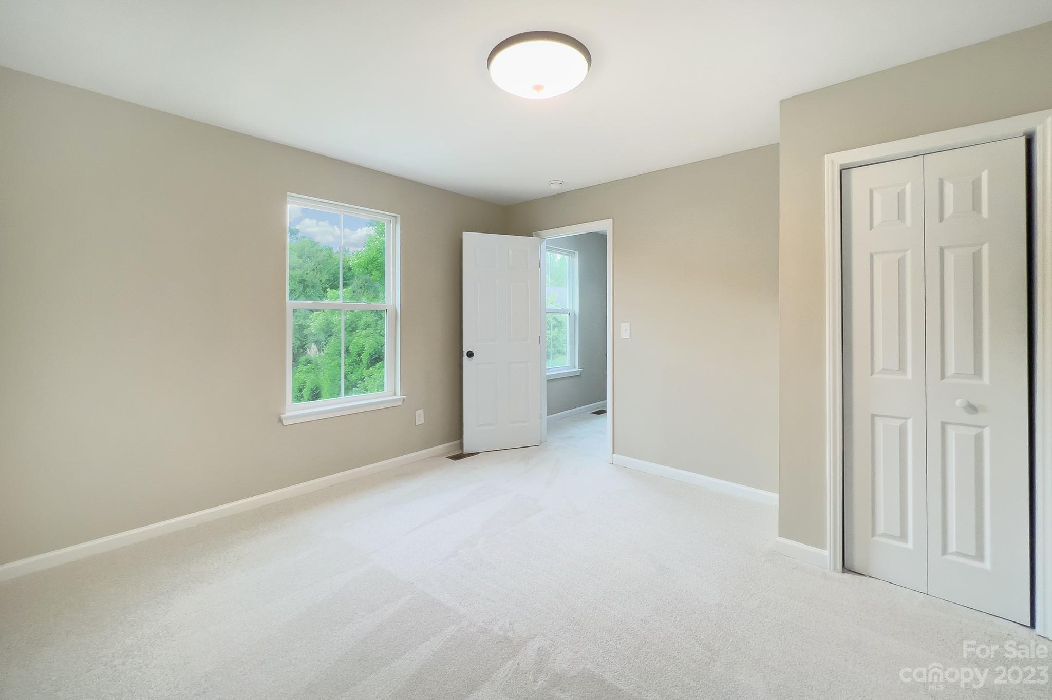 3071 Rhododendron Place Clover, SC 29710 - Photo 23 of 34 an empty room with windows and closet