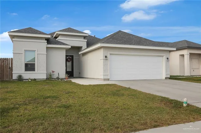 a view of a front of house with garage