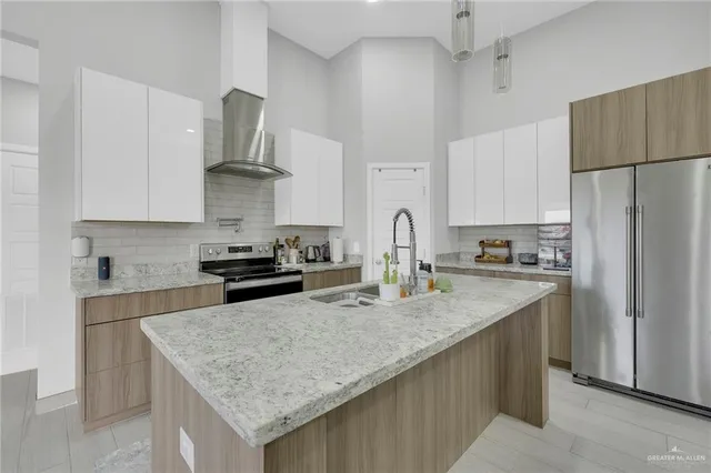 a kitchen with cabinets a sink and a stove