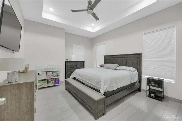 a view of a dining room with furniture and a potted plant