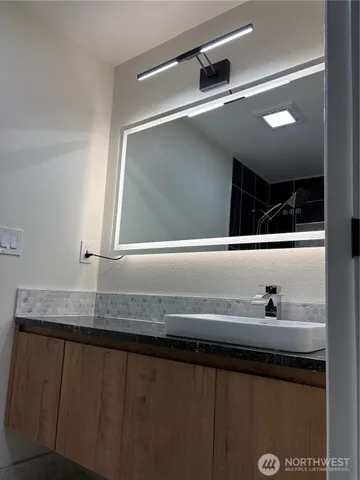a sink with a mirror
