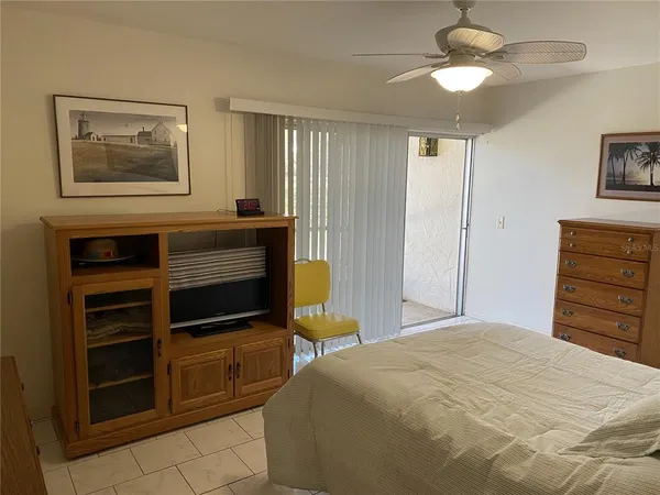 a bedroom with a bed and cabinets