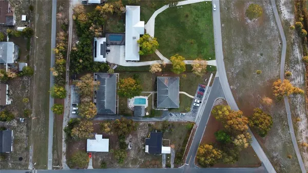 an aerial view of houses with outdoor space