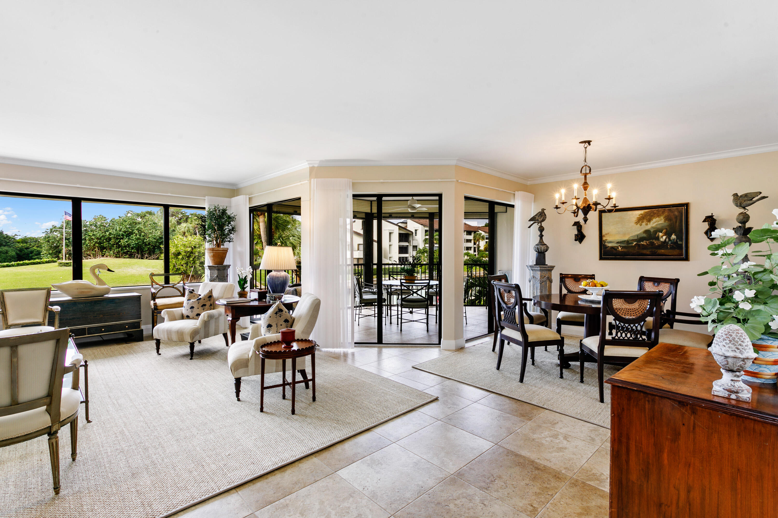 1109 Marine Way East, Unit L2R North Palm Beach, FL 33408 - Photo 3 of 27 a living room with furniture and a flat screen tv