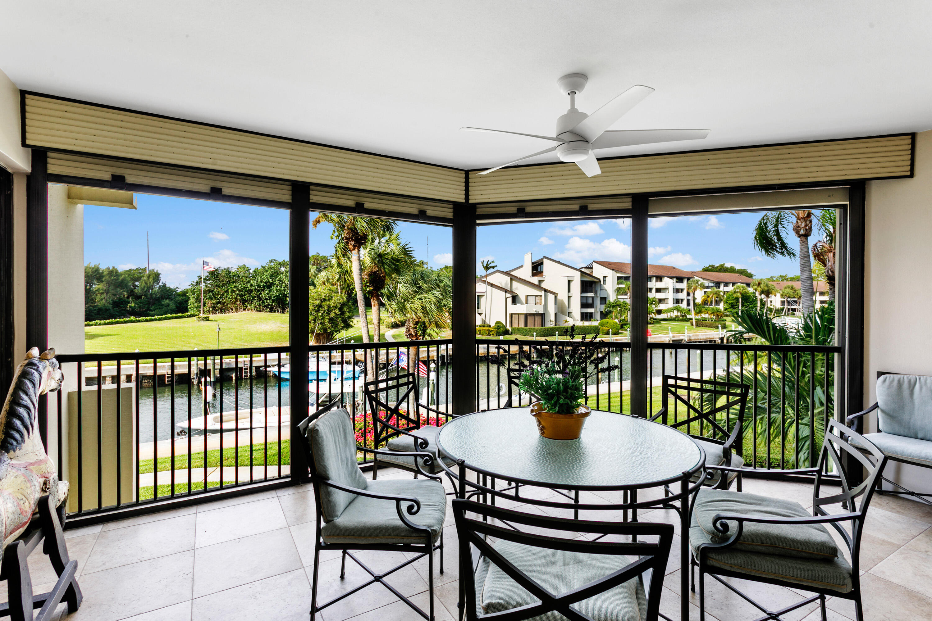 1109 Marine Way East, Unit L2R North Palm Beach, FL 33408 - Photo 7 of 27 a view of a dining room with furniture window and outside view