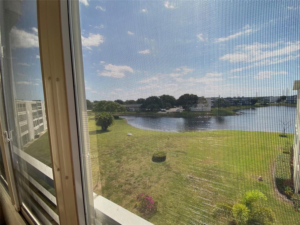 4101 Oakridge V, Unit 4101 Deerfield Beach, FL 33442 - Photo 18 of 42 a view of a lake view