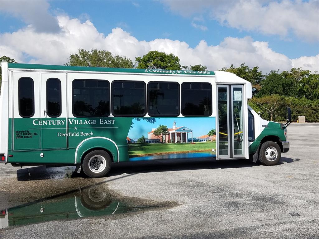 4101 Oakridge V, Unit 4101 Deerfield Beach, FL 33442 - Photo 24 of 42 an outdoor view of a house with outdoor space and barbeque oven