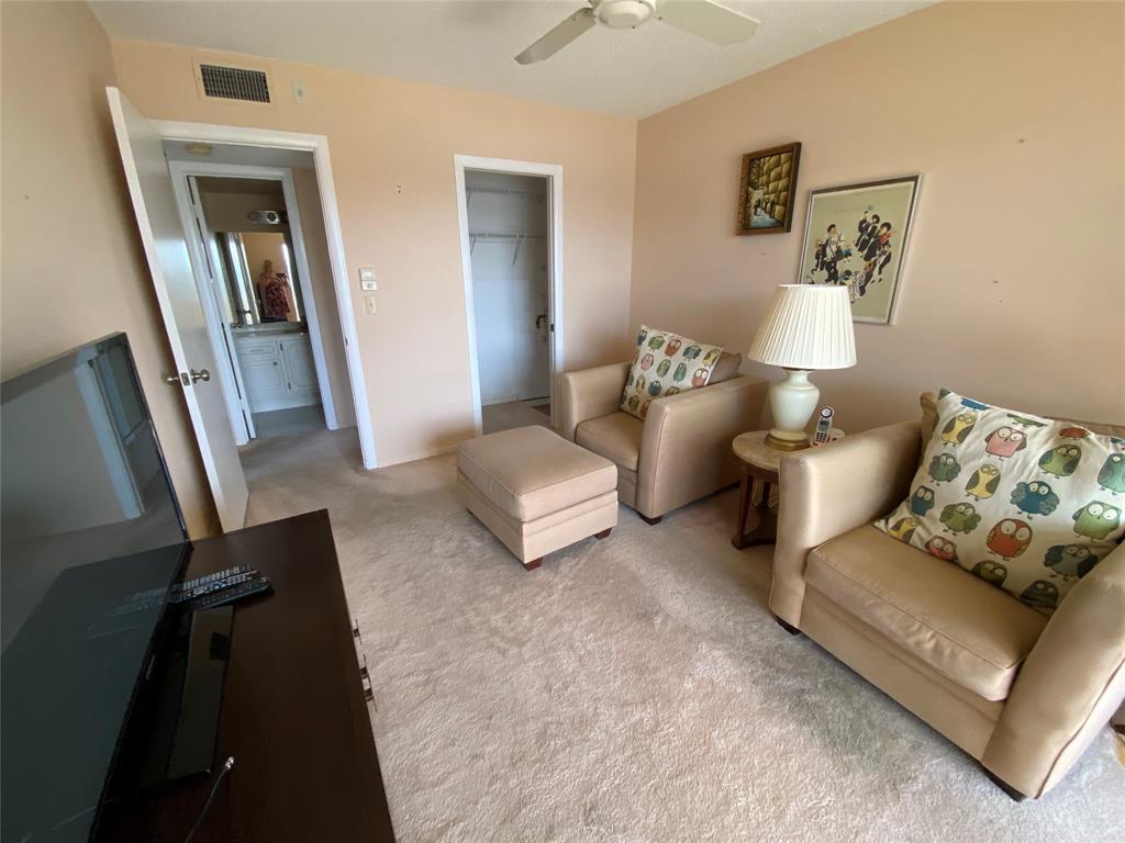 4101 Oakridge V, Unit 4101 Deerfield Beach, FL 33442 - Photo 8 of 42 a living room with furniture and a mirror