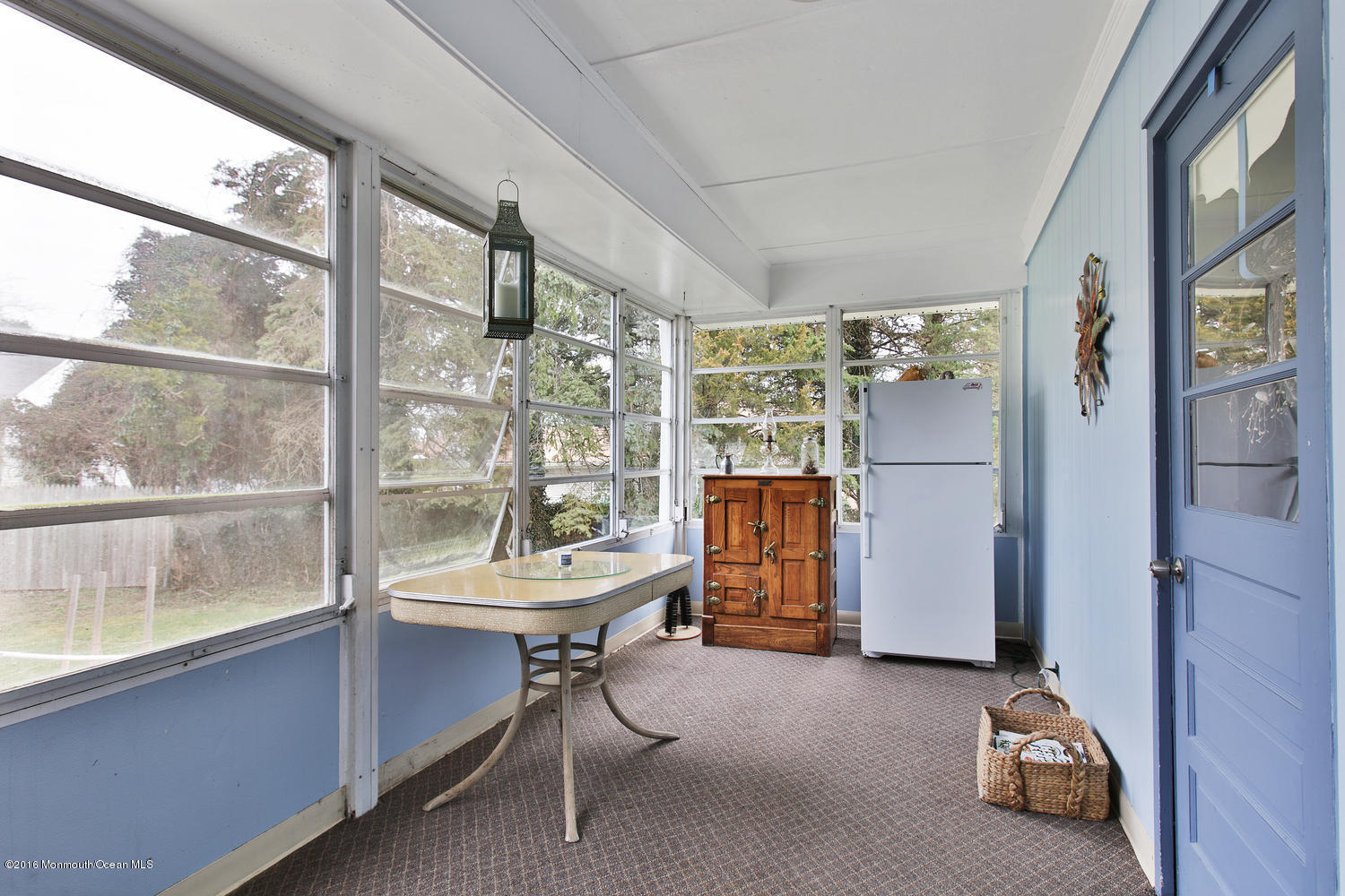 634 Rankin Road Brielle, NJ 08730 - Photo 17 of 23 a room with gym equipment and a large window