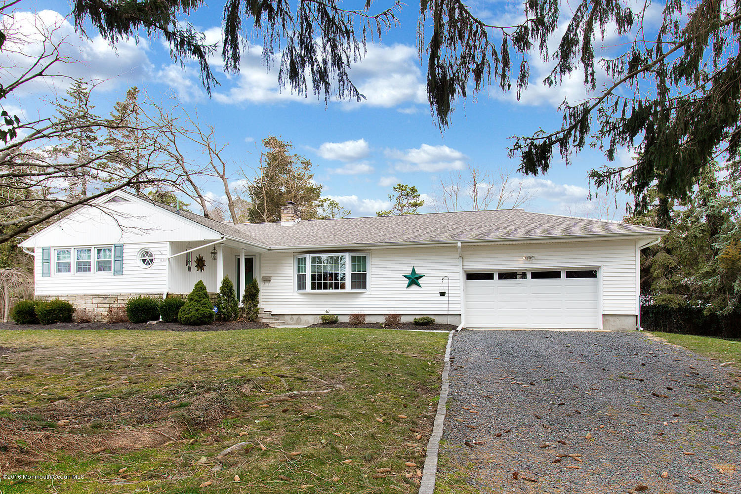 634 Rankin Road Brielle, NJ 08730 - Photo 3 of 23 a front view of a house with a yard and garage