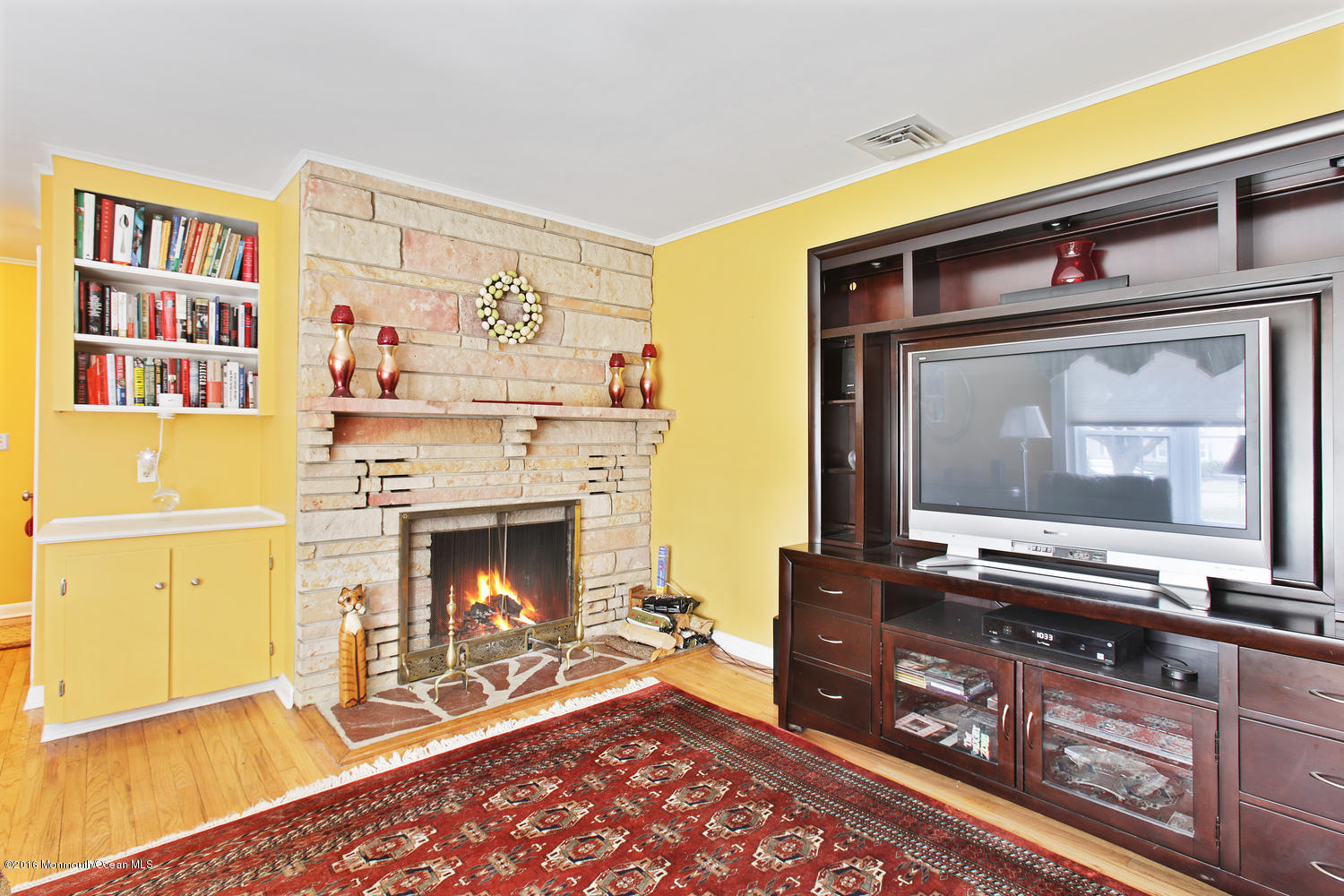 634 Rankin Road Brielle, NJ 08730 - Photo 5 of 23 a living room with furniture and a fireplace