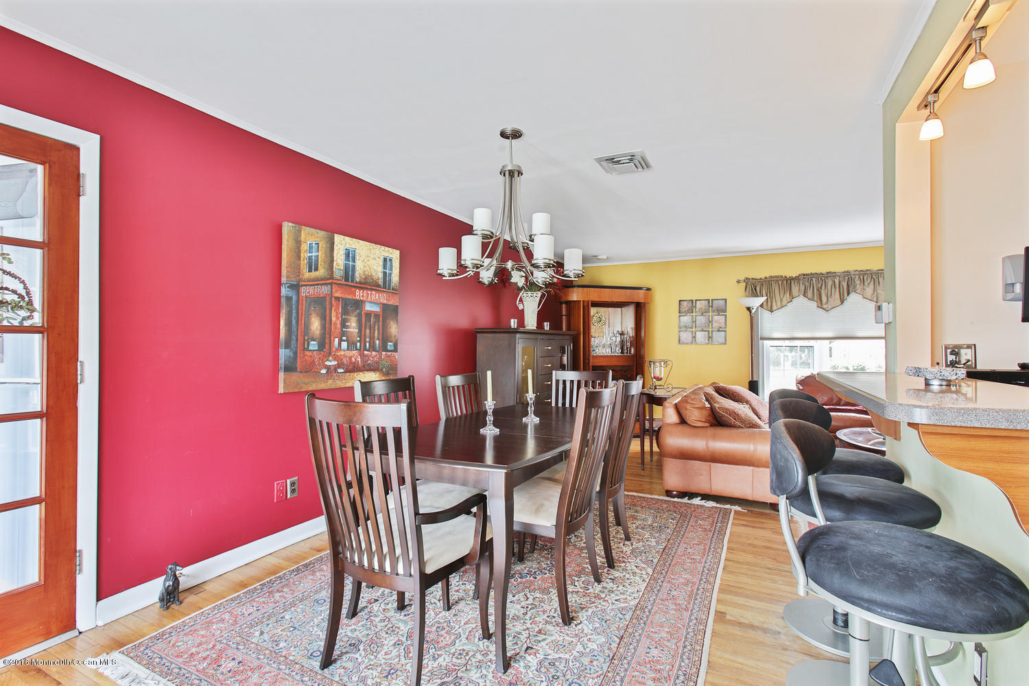 634 Rankin Road Brielle, NJ 08730 - Photo 8 of 23 a dining room with furniture a chandelier and wooden floor