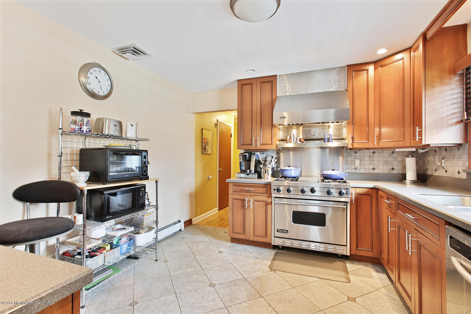 634 Rankin Road Brielle, NJ 08730 - Photo 10 of 23 a kitchen with stainless steel appliances a stove a sink and a refrigerator
