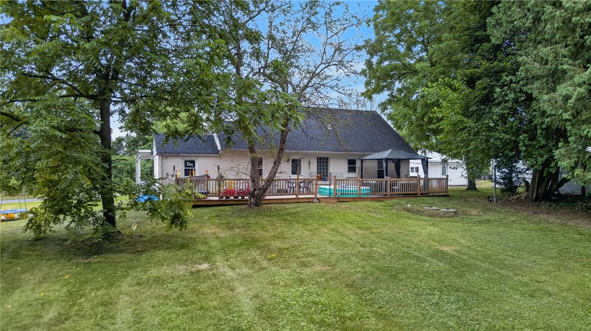 3123 Orefield Road Allentown, PA 18104 - Photo 7 of 39 A spacious backyard unfolds to a multi-level deck, a private above-ground pool, and a charming gazebo, all shaded by mature trees.