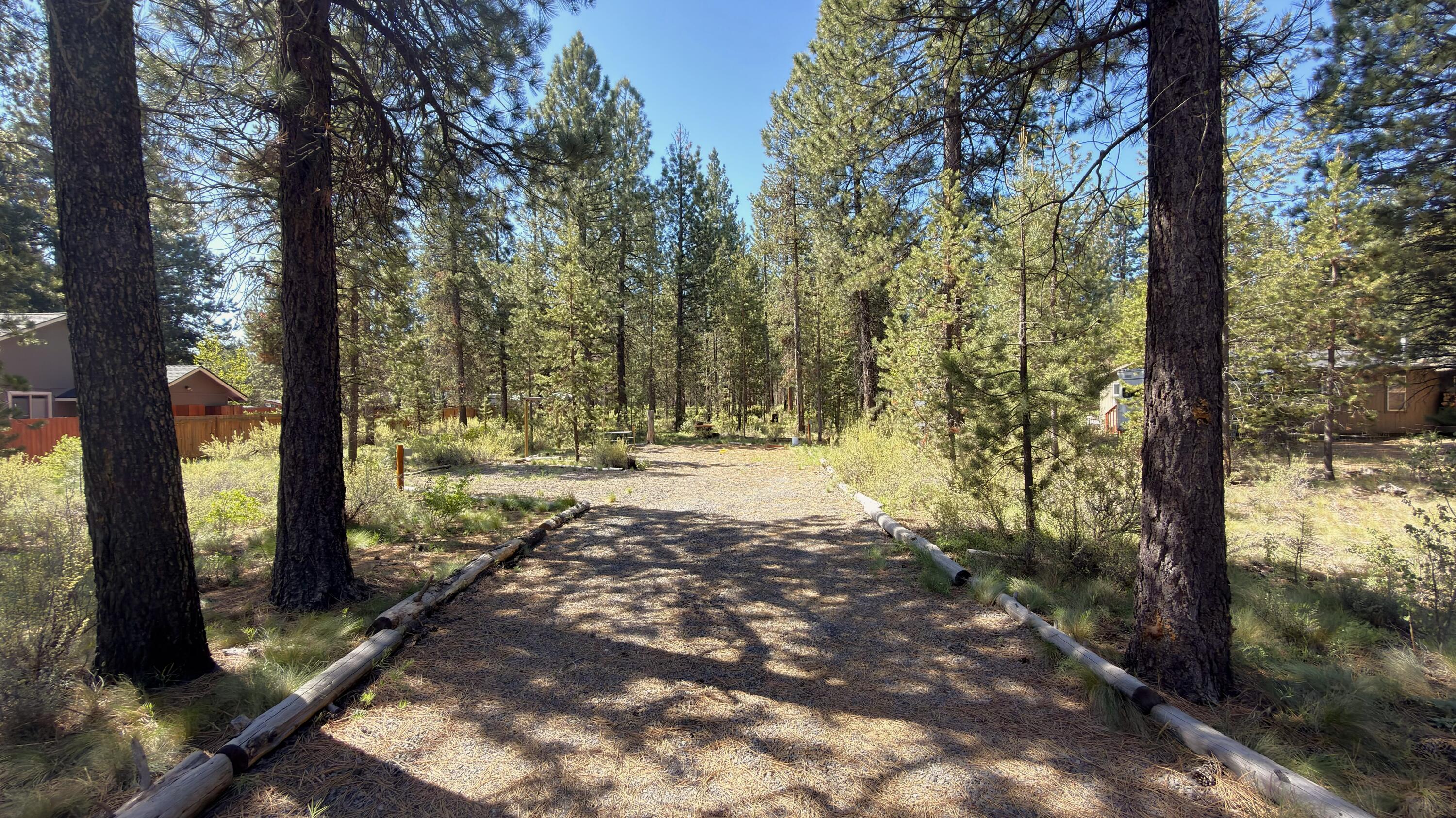 16999 Jacinto Road Bend, OR 97707 - Photo 1 of 38 a view of backyard with tree