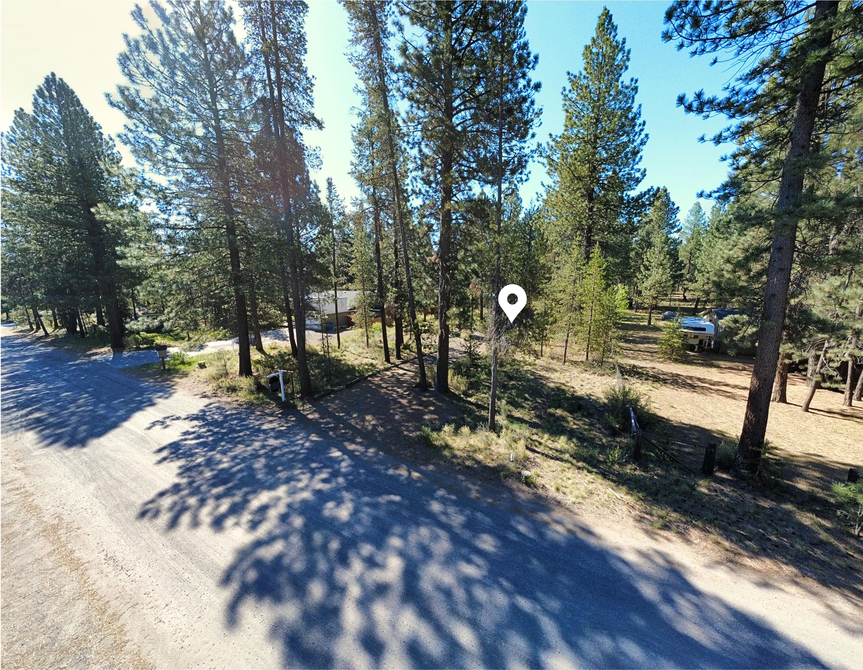 16999 Jacinto Road Bend, OR 97707 - Photo 25 of 38 a view of a park with large trees