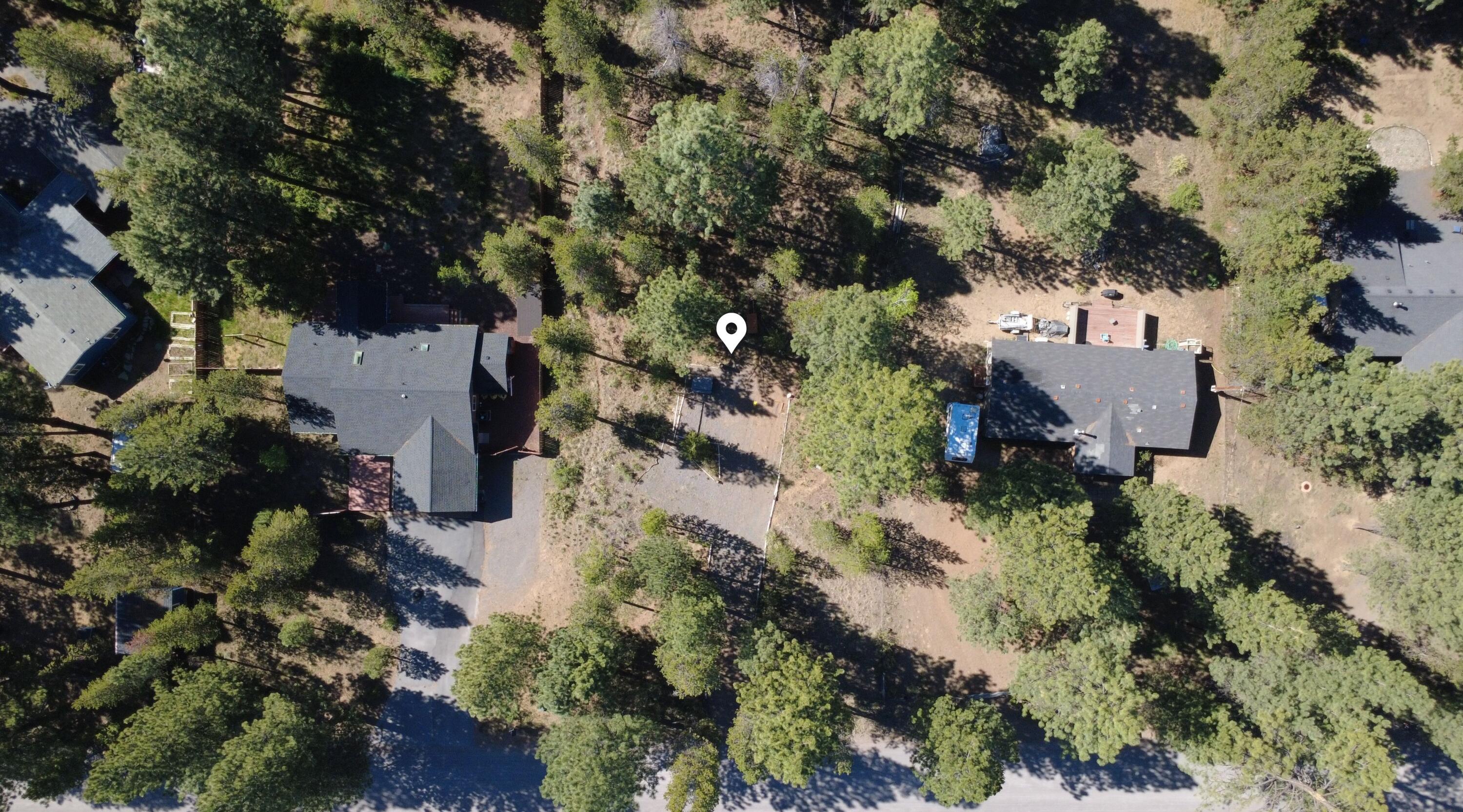 16999 Jacinto Road Bend, OR 97707 - Photo 28 of 38 an aerial view of a house with a yard