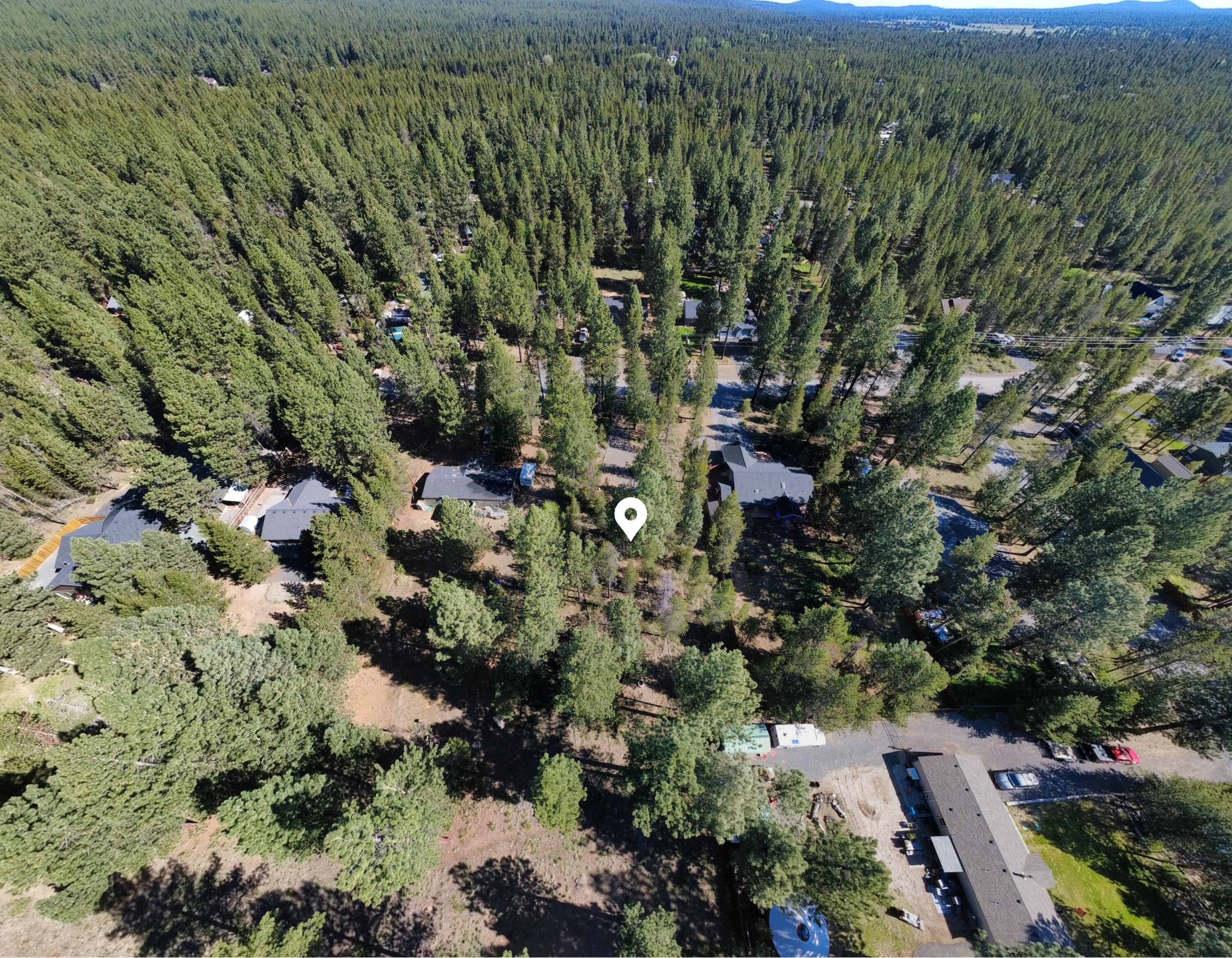 16999 Jacinto Road Bend, OR 97707 - Photo 30 of 38 an aerial view of residential house with parking and yard