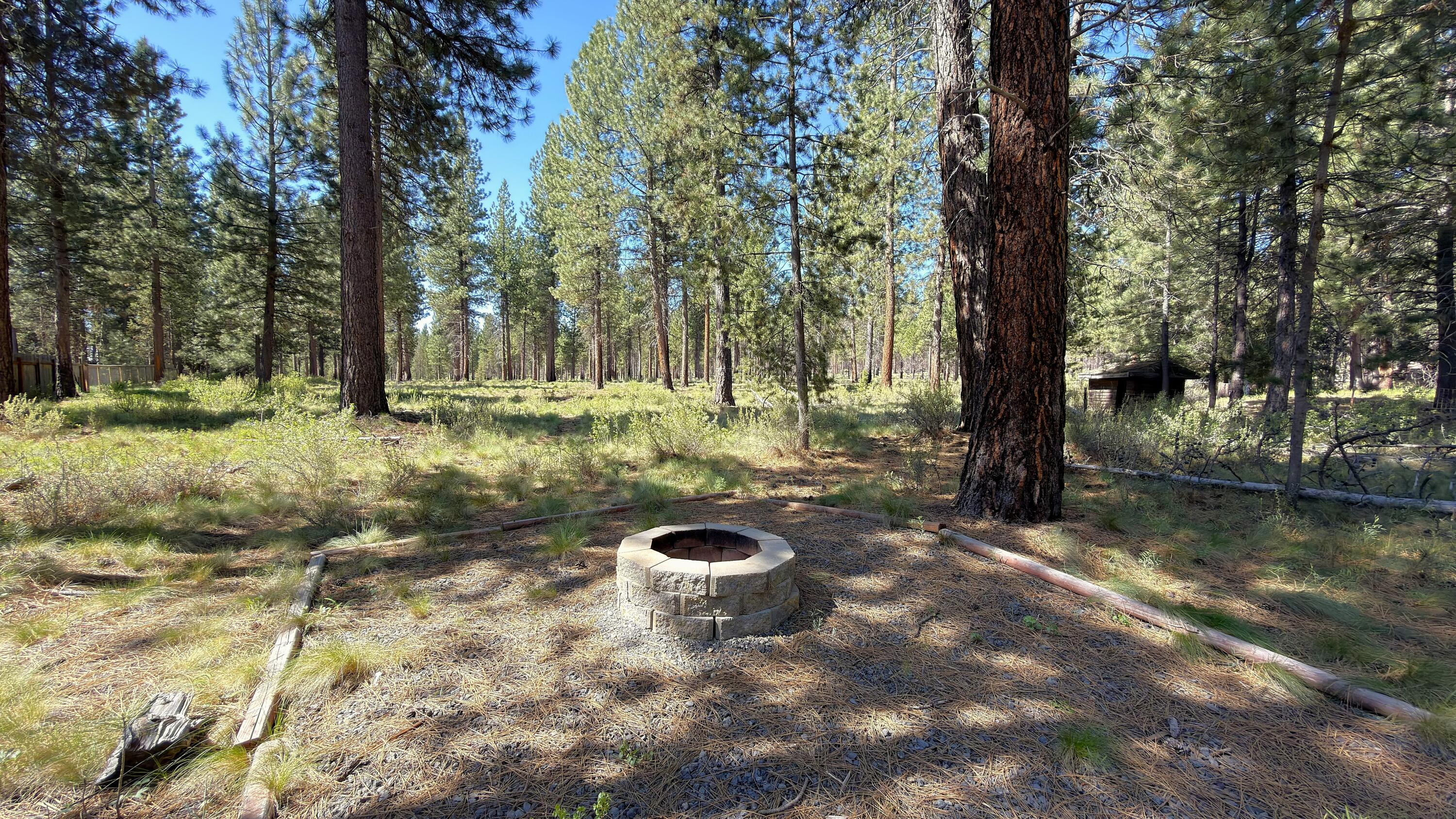 16999 Jacinto Road Bend, OR 97707 - Photo 8 of 38 a backyard of a house with lots of green space
