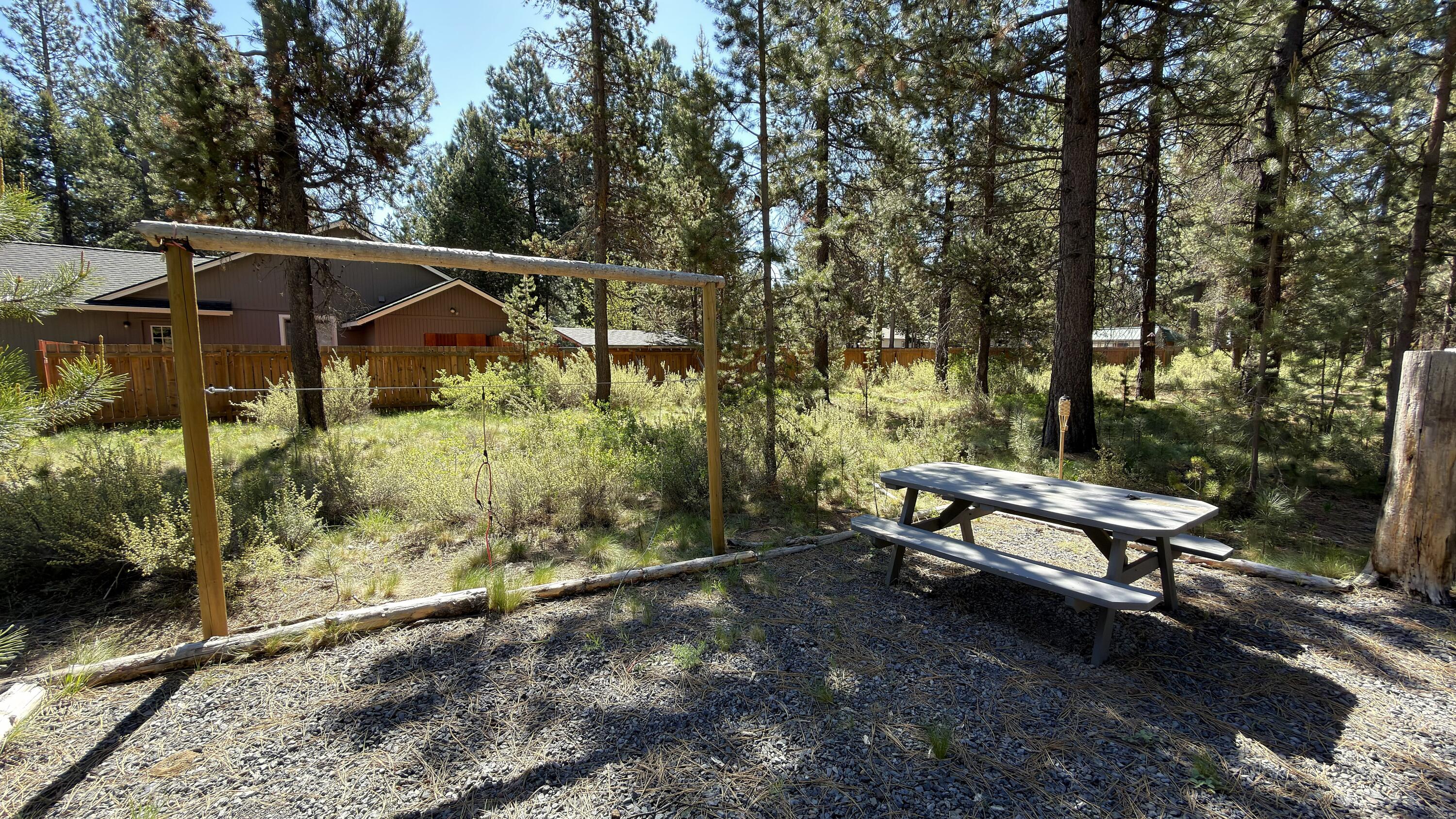16999 Jacinto Road Bend, OR 97707 - Photo 10 of 38 a view of a bench in a backyard