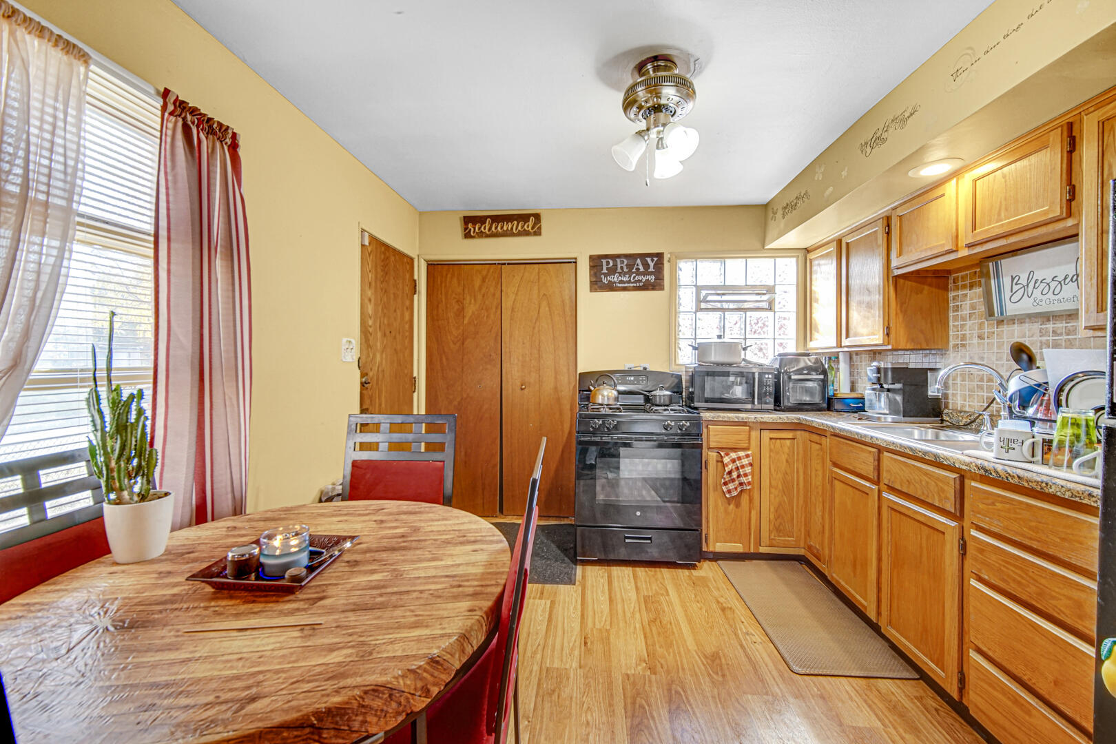 4123 West 19th Place Gary, IN 46404 - Photo 2 of 11 a kitchen with stainless steel appliances kitchen island granite countertop a refrigerator a stove and a sink with dishwasher