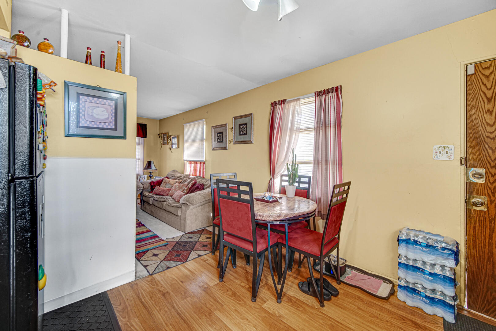 4123 West 19th Place Gary, IN 46404 - Photo 3 of 11 a view of a dining room with furniture and wooden floor