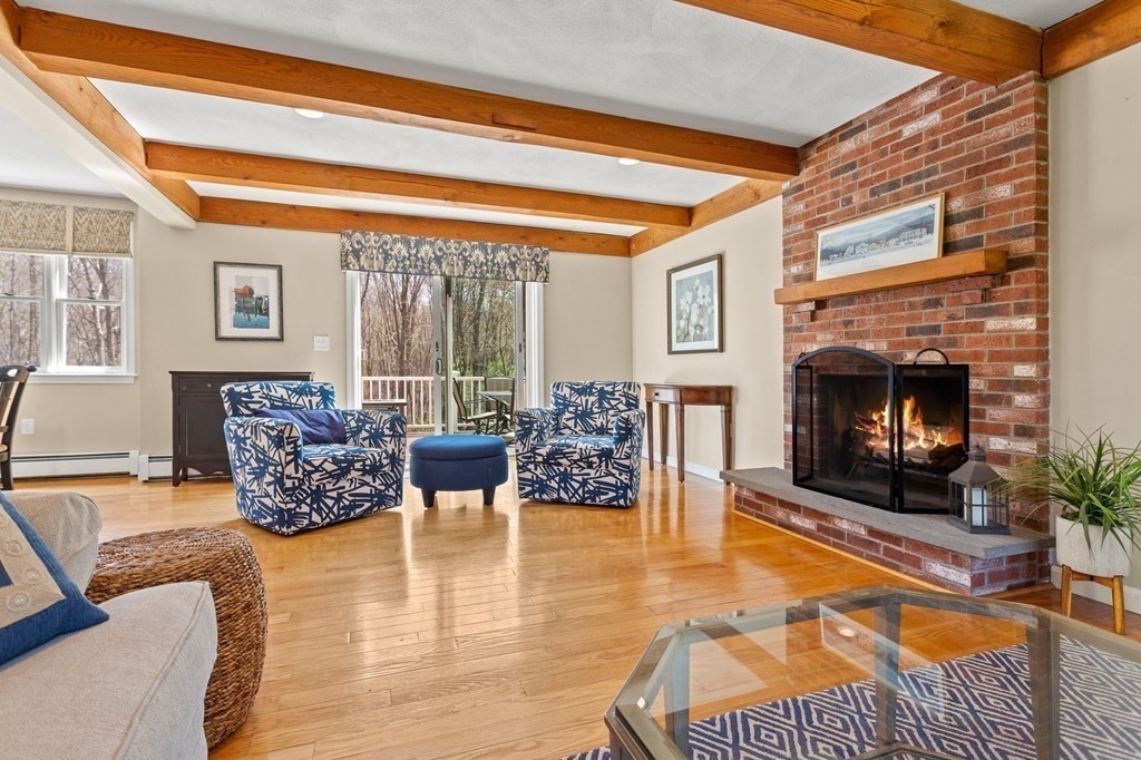 136 Leslie Road Rowley, MA 01969 - Photo 2 of 28 a living room with furniture and a fireplace