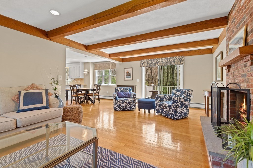 136 Leslie Road Rowley, MA 01969 - Photo 4 of 28 a living room with fireplace furniture and a potted plant