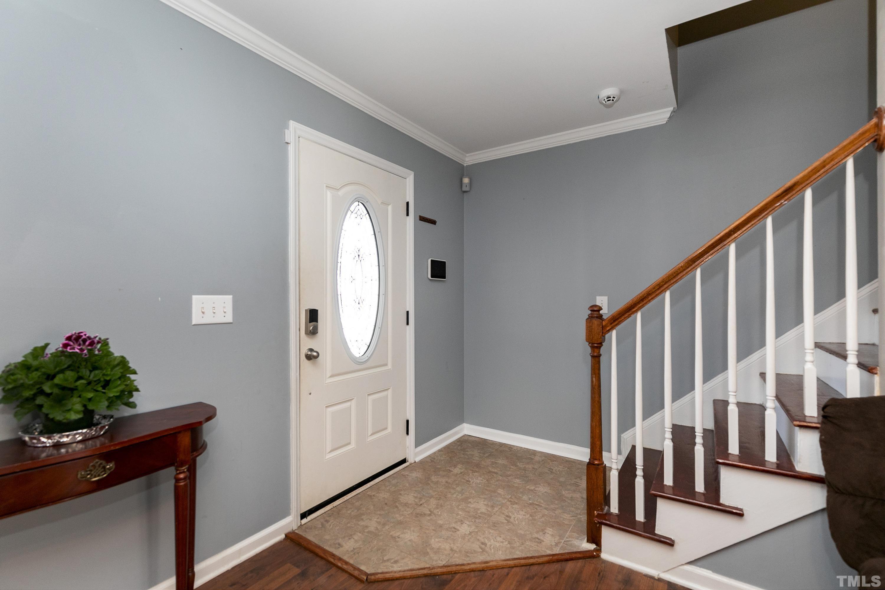 4416 Windstorm Way Raleigh, NC 27616 - Photo 4 of 31 a view of an entryway with wooden floor