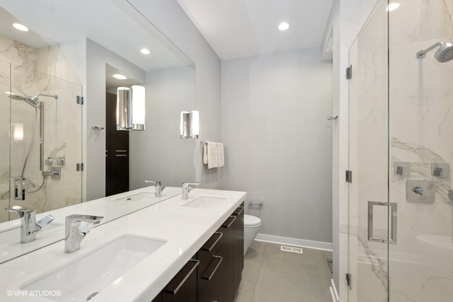 650 West Fulton Street, Unit B Chicago, IL 60661 - Photo 15 of 34 a bathroom with a double vanity sink mirror and shower